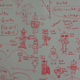 Doodles of robots alongside equations on a whiteboard at SLAC.